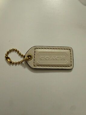 COACH Leather Bag Tag Keychain in Cream with Gold Chain